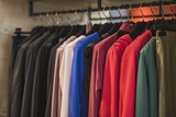 Fototapeta Przestrzenne - Women boutique shop concept - colorful clothing on hangers.