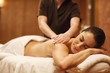 © Zoriana - Beautiful woman relaxing receiving body massage at spa center
