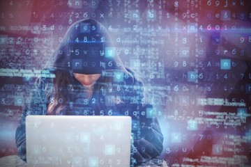 Wall Mural - Composite image of female hacker using laptop