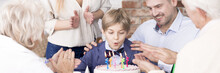 Boy Blowing Candles