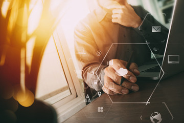 Poster - businessman working with mobile phone and digital tablet and laptop computer on wooden desk in modern office with virtual icon diagram