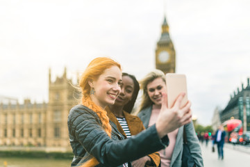 Wall Mural - Girls taking a selfie with Big Ben in London