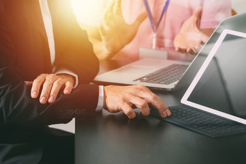 co working team meeting concept,businessman using smart phone and digital tablet and laptop computer in modern office