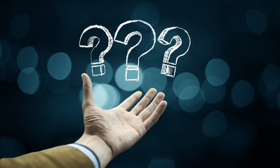 Wall Mural - Question mark in businessman  hand