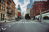 Fototapeta  - New York City street road in Manhattan at summer time. Urban big city life concept background.