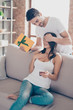 © deagreez - Guess who?! Handsome boyfriend is giving a surprise gift to his amazed girlfriend with closed eyes, which was busy with the mobile phone indoors at home