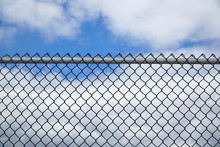 Iron Chainlink Fence Against Sky