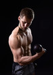 © Igor Normann - Young bodybuilder with dumbbells