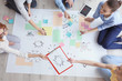 © Africa Studio - Young team working on marketing plan in office