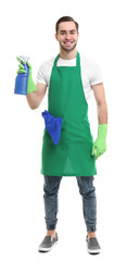 Cleaning concept. Young man in green apron holding cleanser on white background