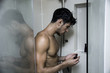 © theartofphoto - Close up Attractive Young Bare Muscular Man after Taking Shower, Getting Soap or Bathfoam or Shampoo