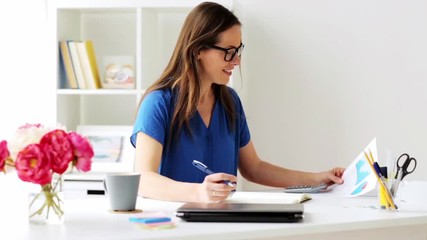 Wall Mural - woman with calculator and notebook at office