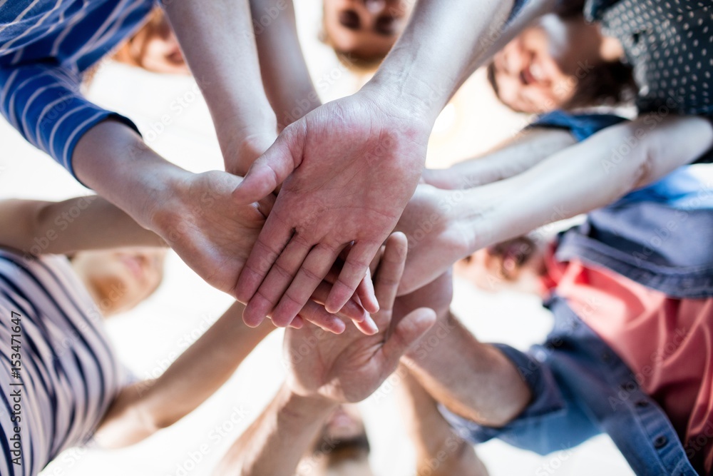 Creative business team stacking hands together Stock Photo | Adobe Stock