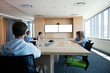 © WavebreakMediaMicro - Creative business team attending a video call in conference room
