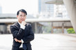 © Bavorndej - Asian Business man standing at outdoor place, portrait business conceptม 30-40 year old.