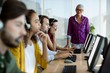 © WavebreakMediaMicro - Customer service executive trainer monitoring her team