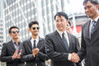 © Jestercine - Asian businessmen handshaking after striking grand dealม 30-40 yeal old.