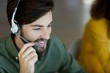 © WavebreakMediaMicro - Smiling customer service executive talking on headset
