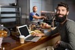 © wavebreak3 - Male customer using laptop while having coffee
