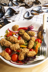 Poster - coated mussel with oat bran and fresh salad