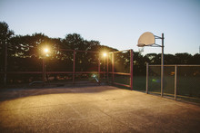 Illuminated Basketball Court Against Clear Sky
