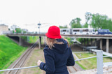 Fototapeta  - Young woman traveler in red cap. Travel concept, soft focus.