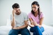 Worried couple finding results of a pregnancy test 