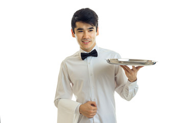 Wall Mural - Chic young waiter's shirt smiling and hands forward tray