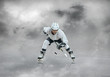© Andrii IURLOV - Ice hockey player in sport action on the ice under sky