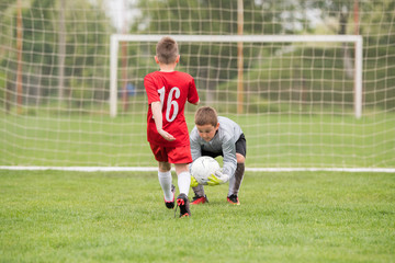 Kids soccer football - children players match on soccer field