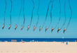 Chain of united kites flying on the beach sideways