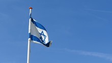 Israeli Flag At Blue Sky