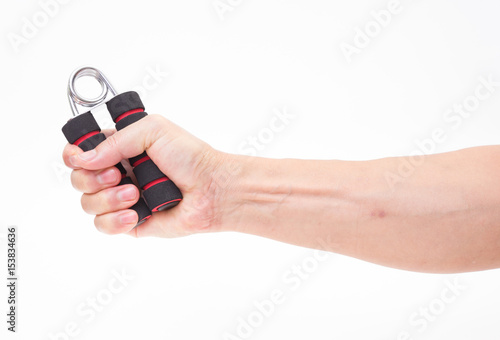 Fotografija  Hand holding sport exercise grip on white background