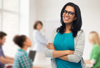 happy smiling young indian woman in glasses