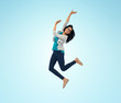 © Syda Productions - smiling young indian woman jumping in air