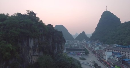 Poster - Top view of amaizing famous Yangshuo valley in Guilin, Guangxi, China. Aerial View of beautiful sunrise over Yangshuo Town in Guilin, China. Overpopulation concept, beauty in nature