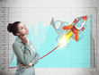 © ImageFlow - African American woman and launching rocket