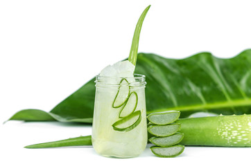 Wall Mural - Aloe Vera plant sliced in glass and green leaf isolated on white background