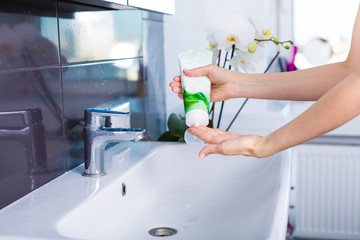 Wall Mural - Woman washing up in the morning