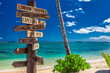 canvas print picture - Street sign indicating directions to different places of the world, taken at Samoa