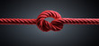 Knoten in rotem Seil