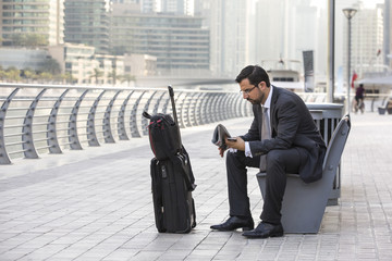 businessman with his suitcase in Dubai Marina