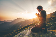Man Praying At Sunset