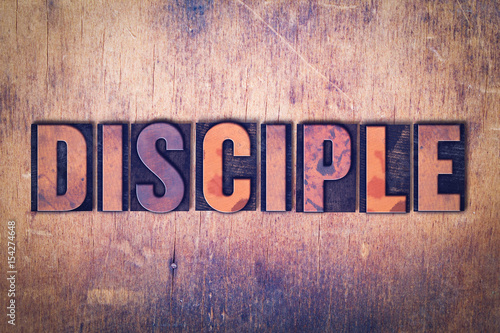 Cuadros en Lienzo Disciple Theme Letterpress Word on Wood Background