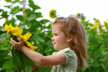 Wall Mural -  girl and sunflower on the field