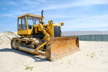 Crawler Caterpillar Bulldozer Used To Push Sand  On Beach