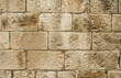 Old sandstone blocks stonewall closeup as background