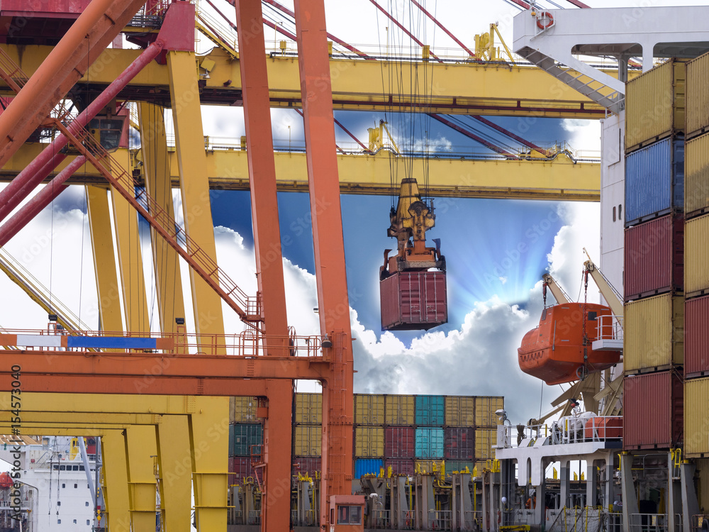 Container Onboard Containers are discharging from vessel by port crane at port of ...