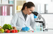 © Africa Studio - Young female nutritionist testing food samples in laboratory