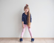 © Africa Studio - Little fashion girl posing in light room